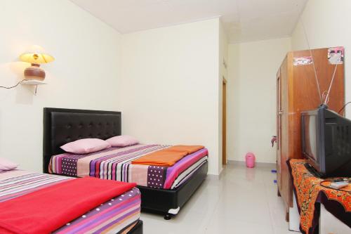 Imagen de la habitación del Hotel Wijaya 2 Kaliurang. Foto 14