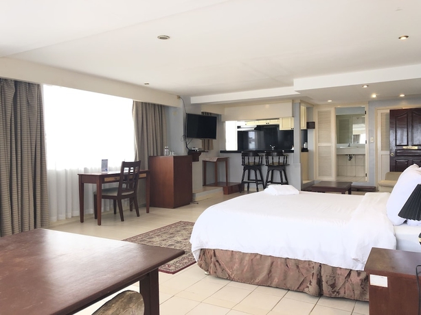 Imagen de la habitación del Hotel Wild Orchid Beach Resort. Foto 2