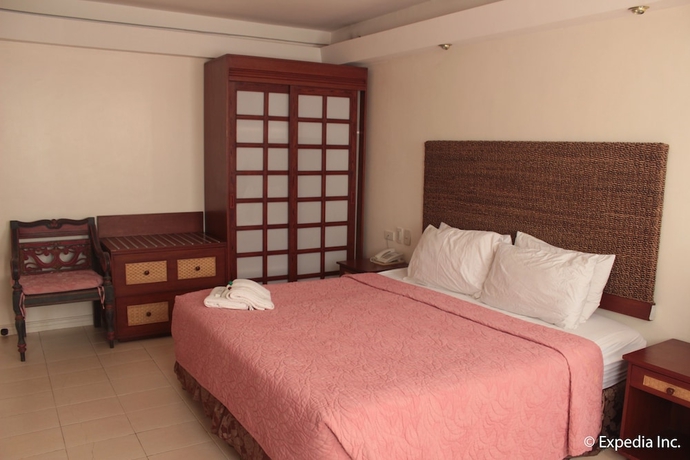 Imagen de la habitación del Hotel Wild Orchid Beach Resort. Foto 8