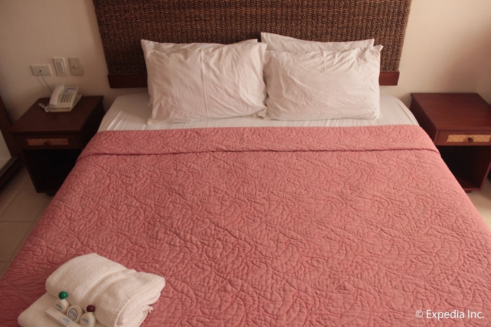 Imagen de la habitación del Hotel Wild Orchid Beach Resort. Foto 10