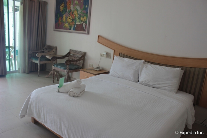 Imagen de la habitación del Hotel Wild Orchid Beach Resort. Foto 13