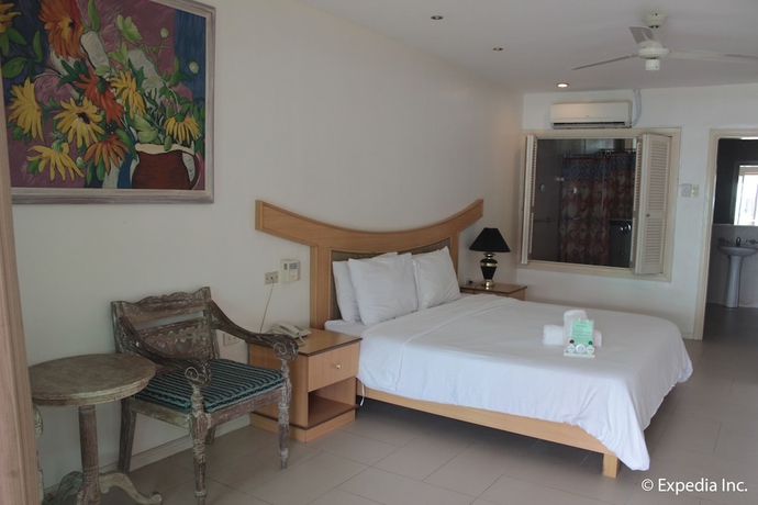 Imagen de la habitación del Hotel Wild Orchid Beach Resort. Foto 15