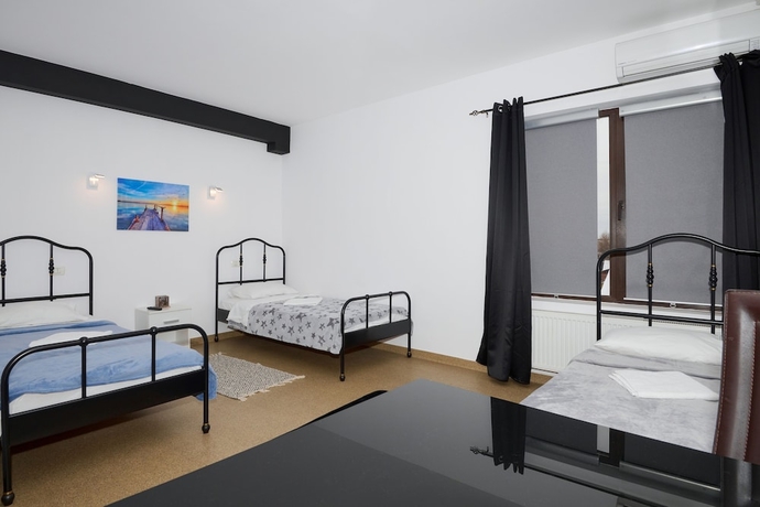 Imagen de la habitación del Hotel William. Foto 6