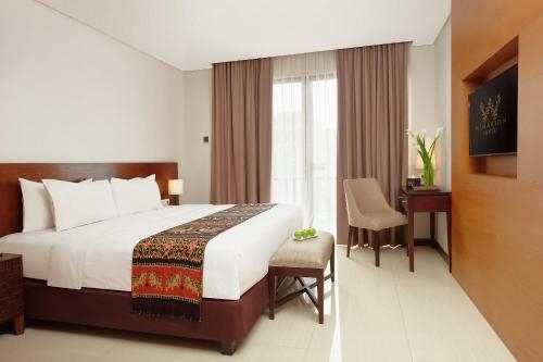 Imagen de la habitación del Hotel Wimarion Semarang. Foto 8