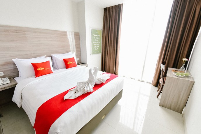 Imagen de la habitación del Hotel Win Grand. Foto 17