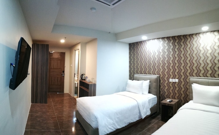 Imagen de la habitación del Hotel Win Premier Mangga Besar. Foto 2