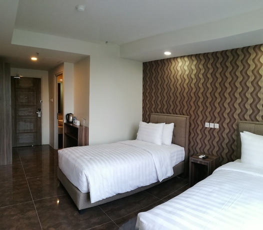 Imagen de la habitación del Hotel Win Premier Mangga Besar. Foto 3