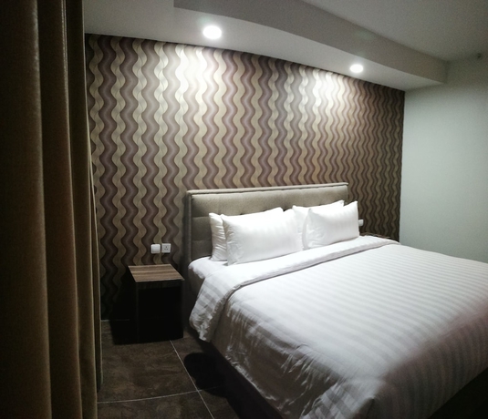 Imagen de la habitación del Hotel Win Premier Mangga Besar. Foto 4