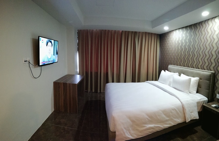 Imagen de la habitación del Hotel Win Premier Mangga Besar. Foto 5