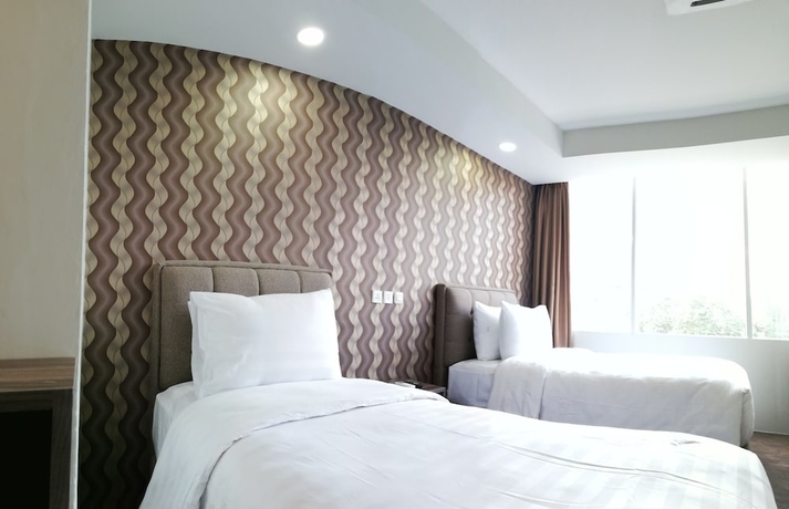 Imagen de la habitación del Hotel Win Premier Mangga Besar. Foto 12