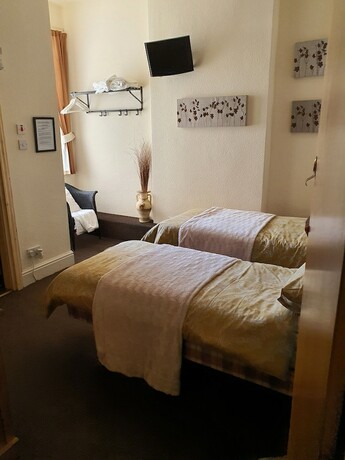 Imagen de la habitación del Hotel Windsor House. Foto 12