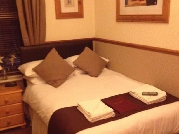 Imagen de la habitación del Hotel Windsor House - Guest House. Foto 13