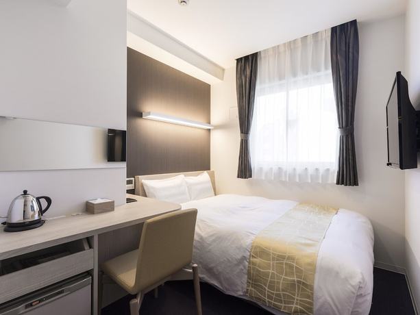 Imagen de la habitación del Hotel Wing International Hakata Shinkansenguchi. Foto 16