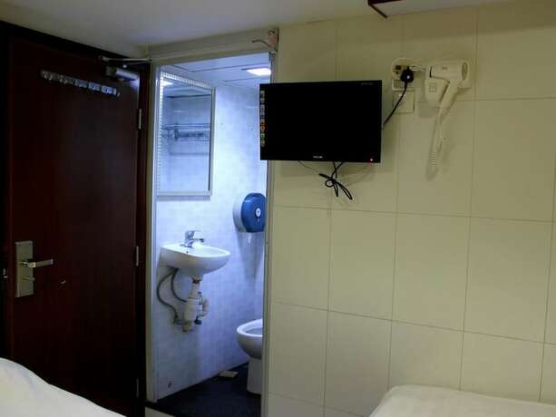Imagen de la habitación del Hotel Wing On. Foto 15
