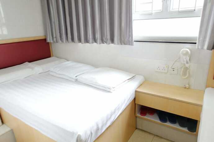 Imagen de la habitación del Hotel Wing Sing Hong Guesthouse. Foto 12