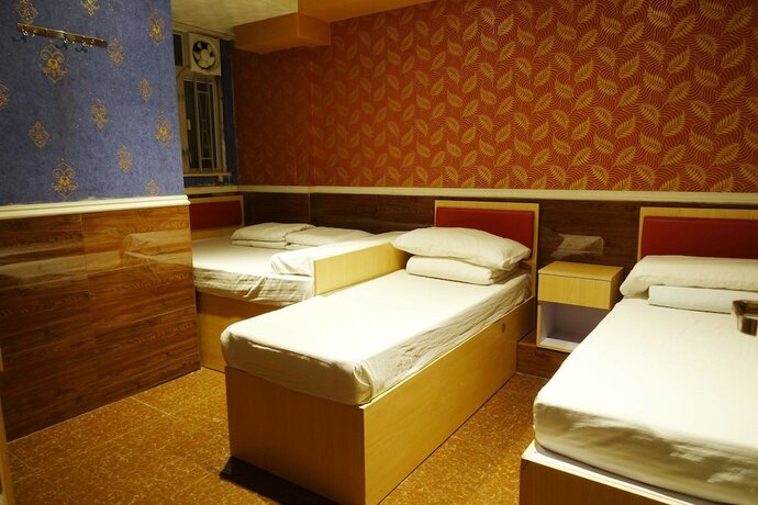 Imagen de la habitación del Hotel Wing Sing Hong Guesthouse. Foto 13