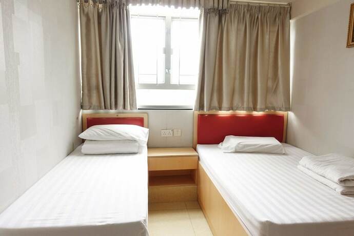Imagen de la habitación del Hotel Wing Sing Hong Guesthouse. Foto 15