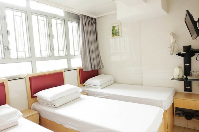 Imagen de la habitación del Hotel Wing Sing Hong Guesthouse. Foto 16