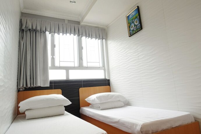 Imagen de la habitación del Hotel Wing Sing Hong Guesthouse. Foto 18