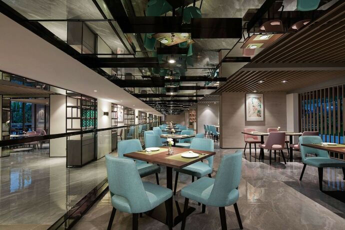 Imagen del bar/restaurante del Hotel Wingate By Wyndham Xishuangbanna. Foto 14