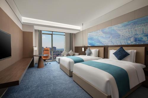 Imagen de la habitación del Hotel Wingate by Wyndham Kunming Airport. Foto 8