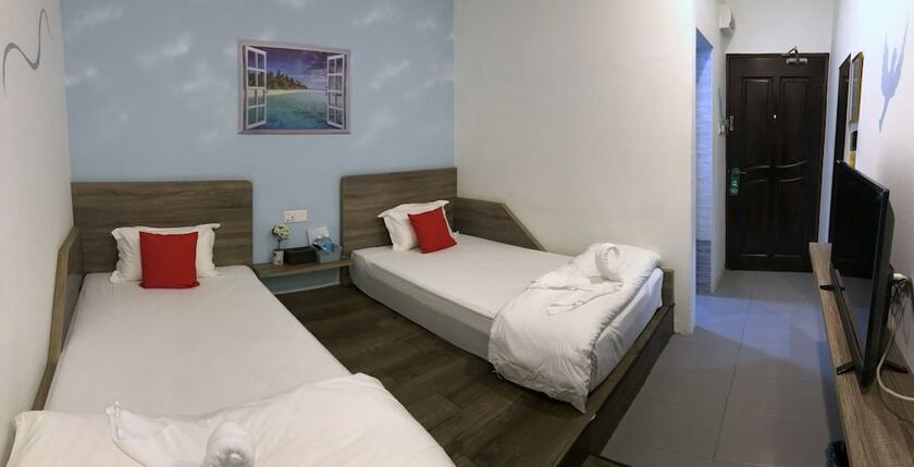 Imagen de la habitación del Hotel Winggarden Murals House. Foto 12