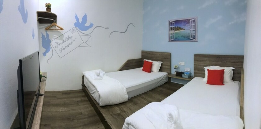 Imagen de la habitación del Hotel Winggarden Murals House. Foto 30