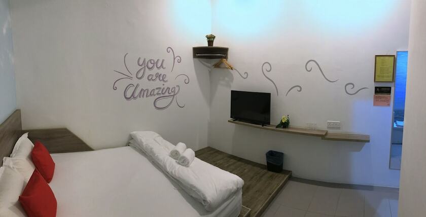 Imagen de la habitación del Hotel Winggarden Murals House. Foto 32
