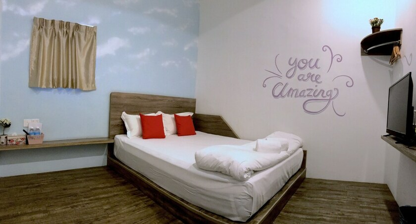 Imagen de la habitación del Hotel Winggarden Murals House. Foto 36