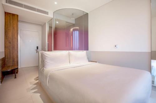 Imagen de la habitación del Hotel Wink Can Tho - 24hrs stay & Rooftop Pool Bar. Foto 9