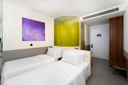 Imagen de la habitación del Hotel Wink Can Tho - 24hrs stay & Rooftop Pool Bar. Foto 10
