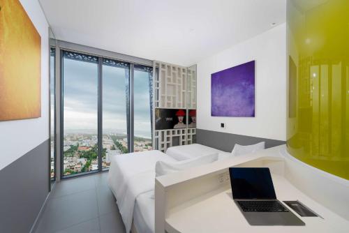 Imagen de la habitación del Hotel Wink Can Tho - 24hrs stay & Rooftop Pool Bar. Foto 11