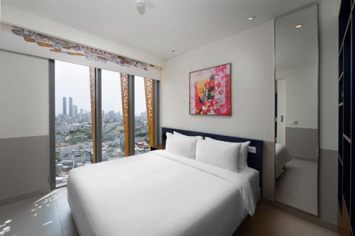 Imagen de la habitación del Hotel Wink Can Tho - 24hrs stay & Rooftop Pool Bar. Foto 15