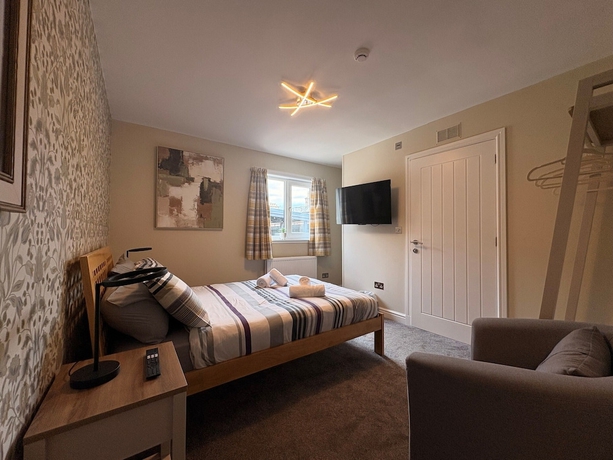 Imagen de la habitación del Hotel Winmar Guesthouse. Foto 7