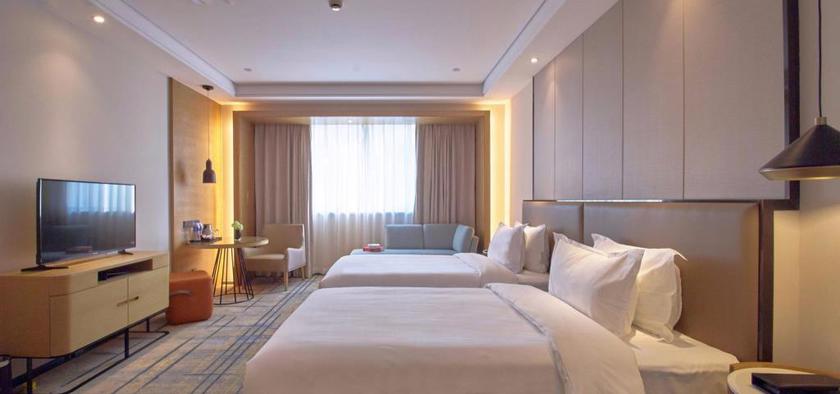 Imagen de la habitación del Hotel Wisdom Rose Hotel Shanghai. Foto 9