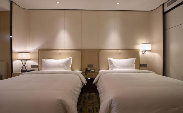 Imagen de la habitación del Hotel Wisdom Rose Hotel Shanghai. Foto 11