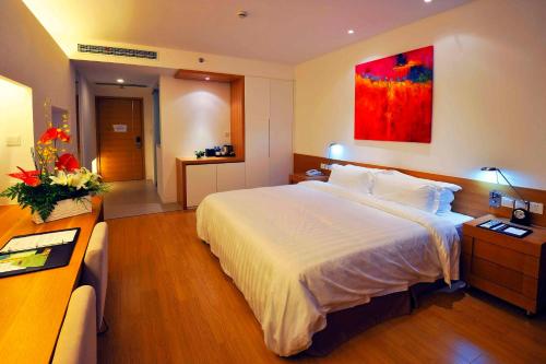 Imagen de la habitación del Hotel Wisdom Shanghai. Foto 4