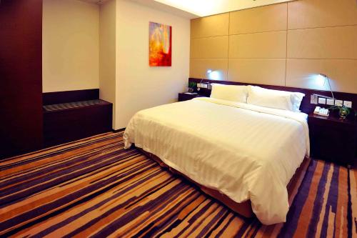 Imagen de la habitación del Hotel Wisdom Shanghai. Foto 5