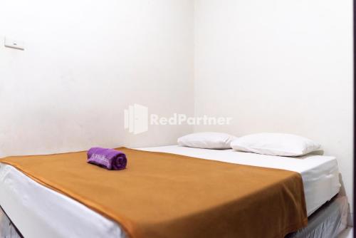 Imagen de la habitación del Hotel Wisma Aini Syariah Mitra RedDoorz. Foto 17