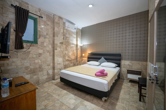 Imagen de la habitación del Hotel Wisma Asia Busindo Syariah. Foto 2