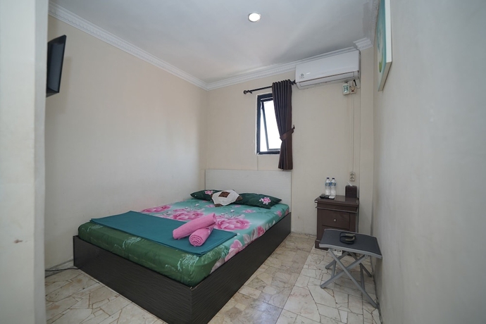 Imagen de la habitación del Hotel Wisma Asia Busindo Syariah. Foto 4