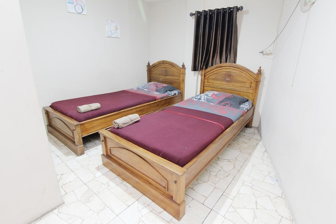 Imagen de la habitación del Hotel Wisma Asia Busindo Syariah. Foto 7