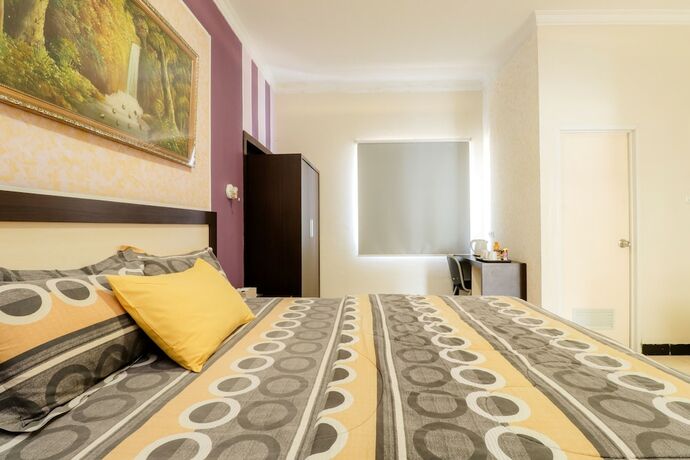 Imagen de la habitación del Hotel Wisma Banda. Foto 14
