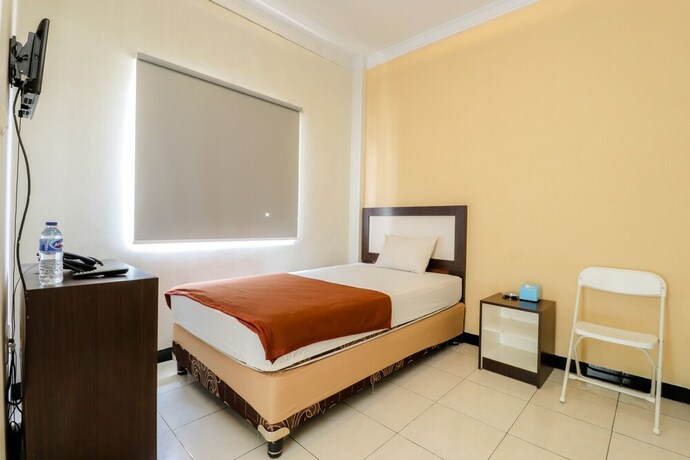 Imagen de la habitación del Hotel Wisma Banda. Foto 17