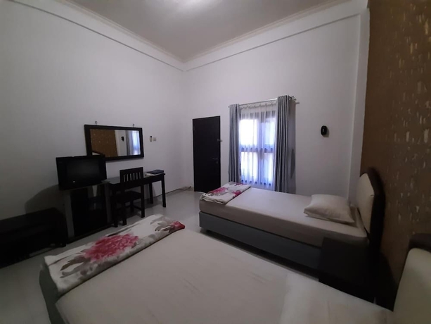 Imagen de la habitación del Hotel Wisma Liontine. Foto 14