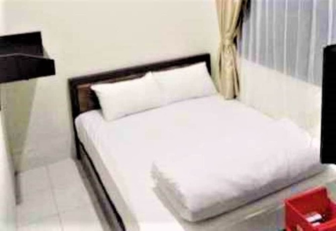 Imagen de la habitación del Hotel Wisma Makassar. Foto 7