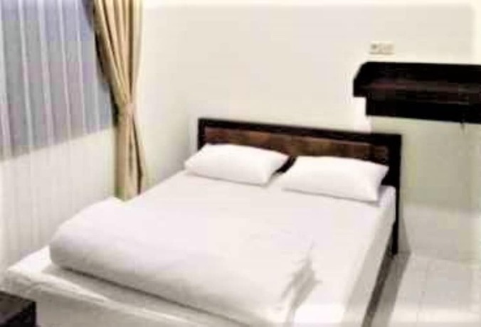 Imagen de la habitación del Hotel Wisma Makassar. Foto 8