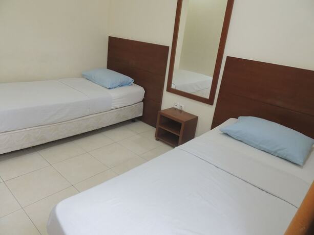Imagen de la habitación del Hotel Wisma Tamu UKSW. Foto 12