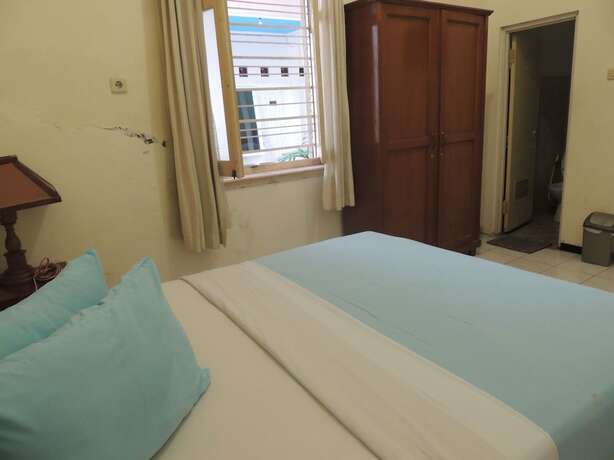 Imagen de la habitación del Hotel Wisma Tamu UKSW. Foto 14