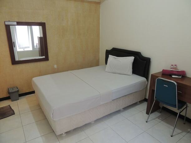 Imagen de la habitación del Hotel Wisma Tamu UKSW. Foto 15